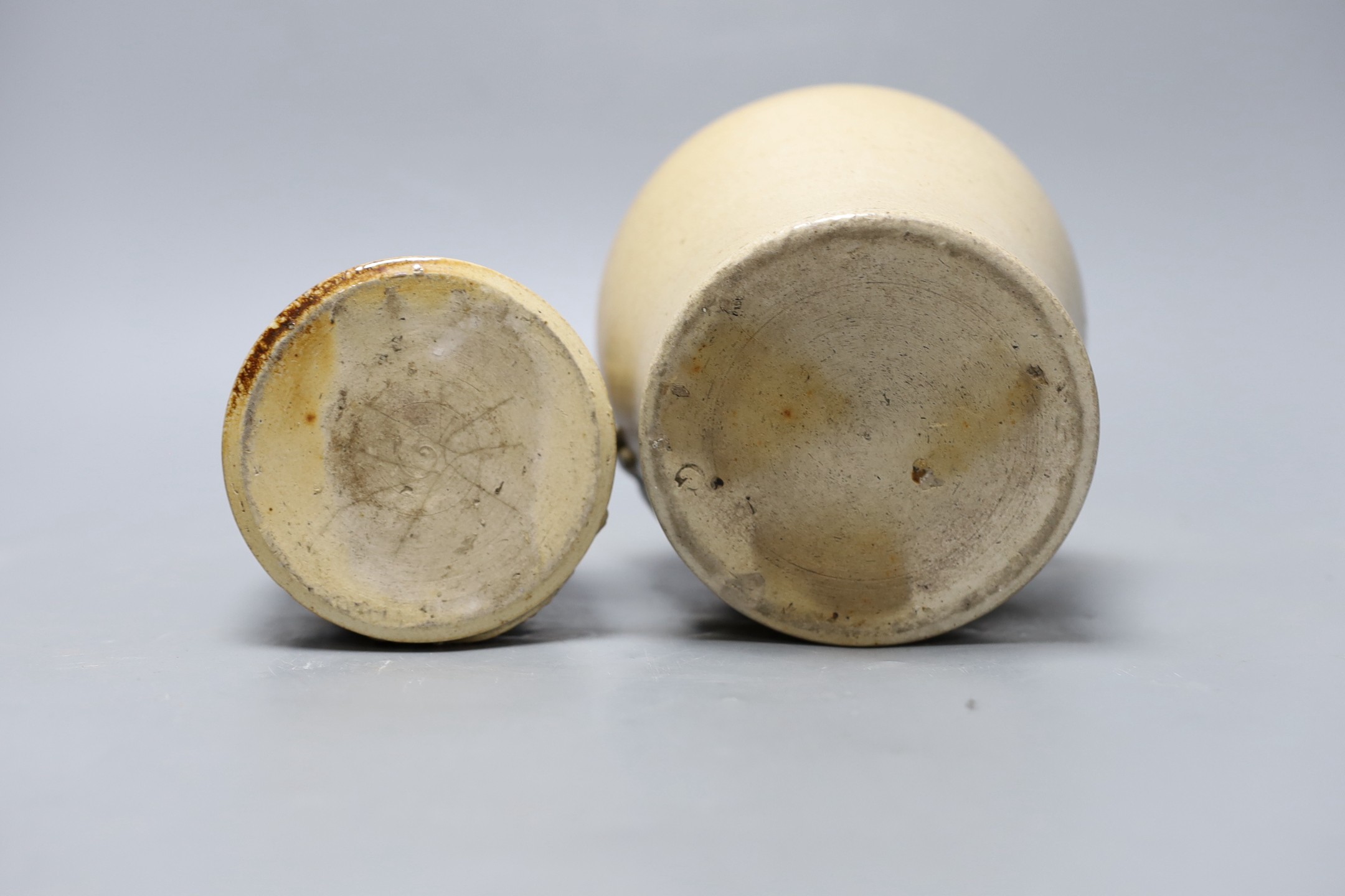 Two 19th century salt glazed stoneware storage jars, with Royal coat of arms sprigging, Tallest 18cm high